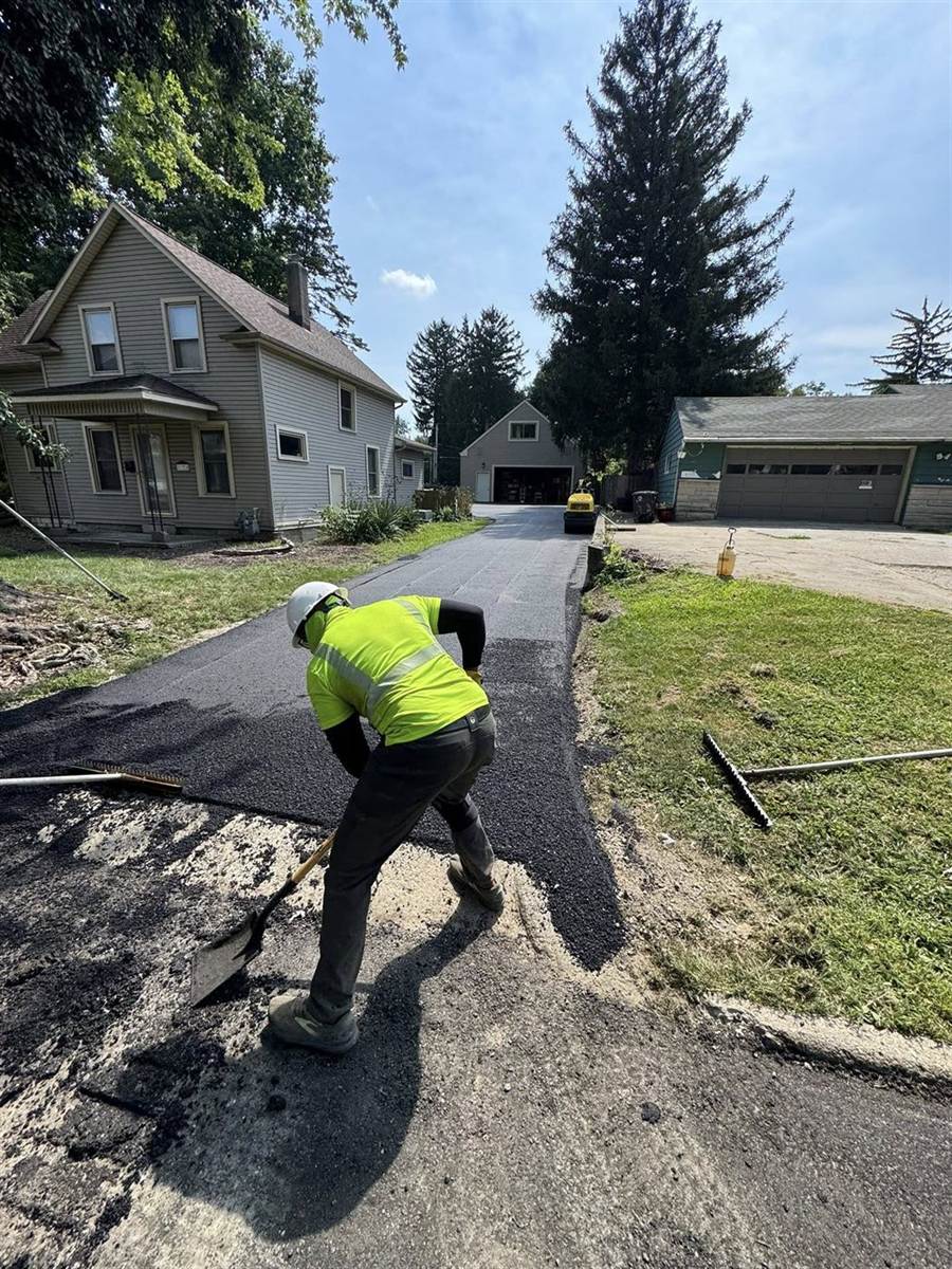 Paul's Asphalt Paving crew at work on a Fort Wayne driveway