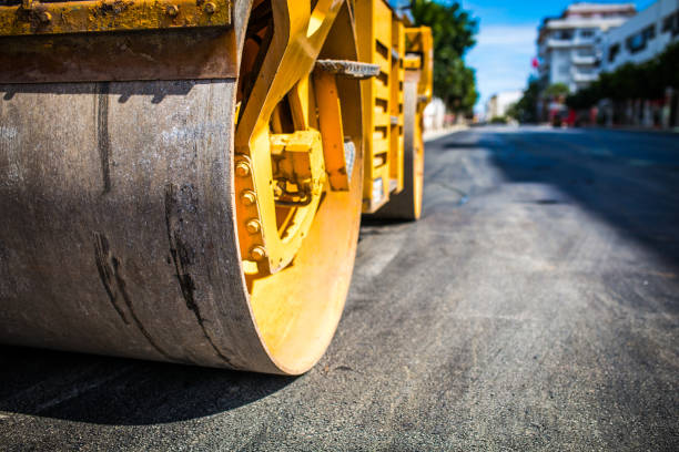 Roadworks, rolling a new layer of the road.